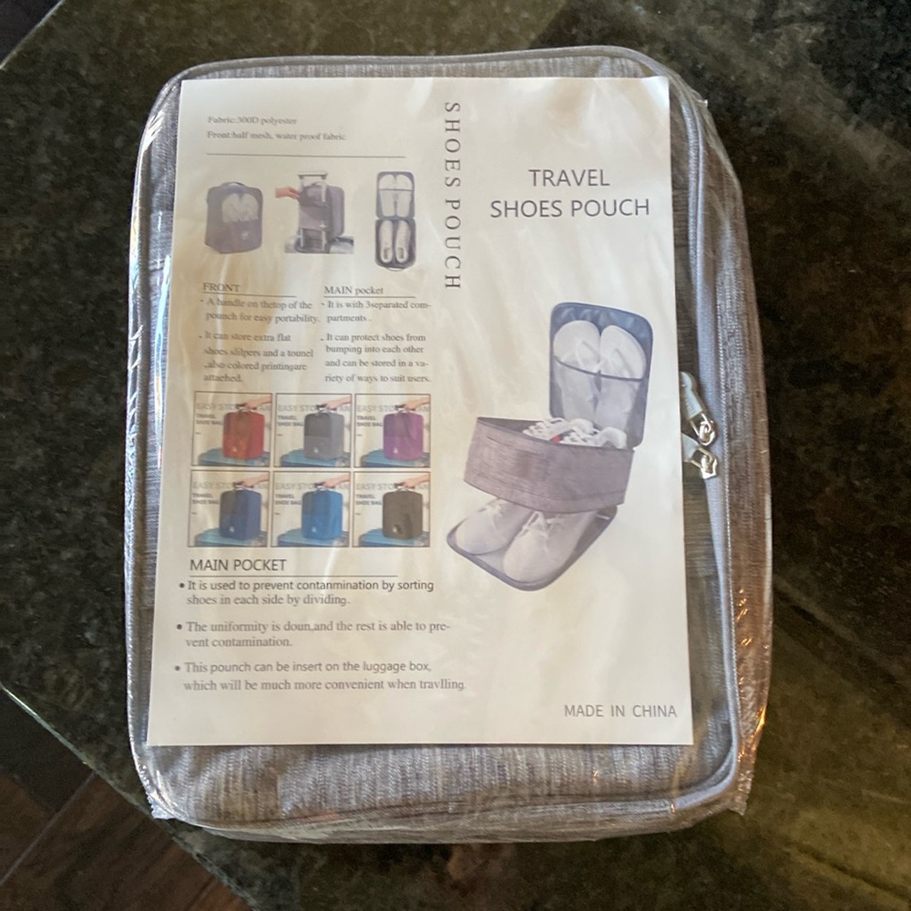 Travel shoe pouch. 3 separate compartments. Slide on carry on.NEW never opened